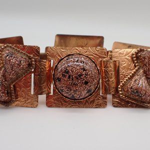 Vintage Confetti copper and black Lucite hinged bracelet.